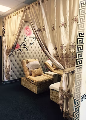 Sunshine Foot Spa & Massage interior rooms featuring ornate golden chairs, massage beds with white towels, and elegant decorative backdrops