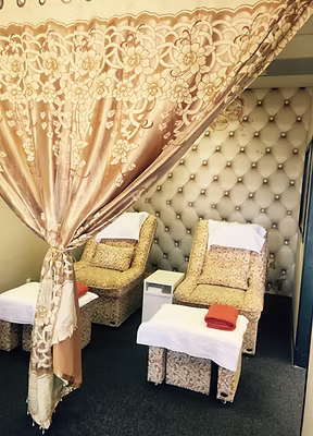 Sunshine Foot Spa & Massage interior gallery showing treatment rooms, massage chairs, and decorative dragon wall murals